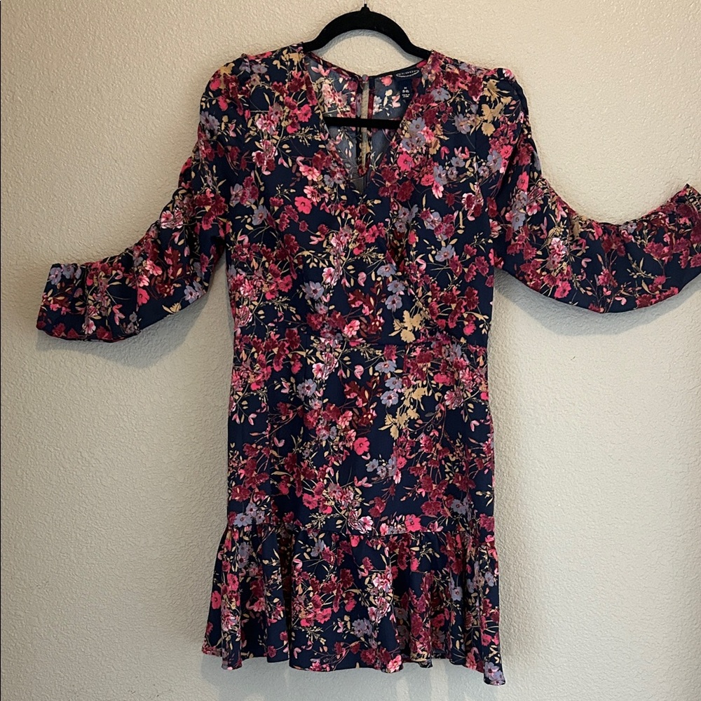 Floral Dress with pink and purple flowers on a dark blue background. Size M 8-10